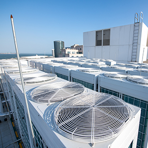 Row of industrial HVAC units on a rooftop