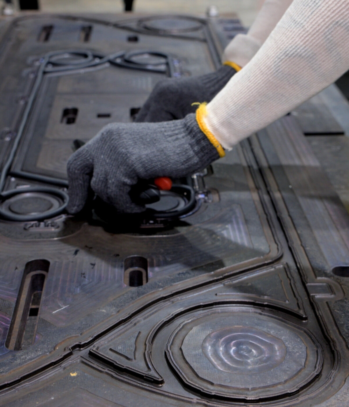 Closeup of gloved hands placing a gasket in a heat exchanger