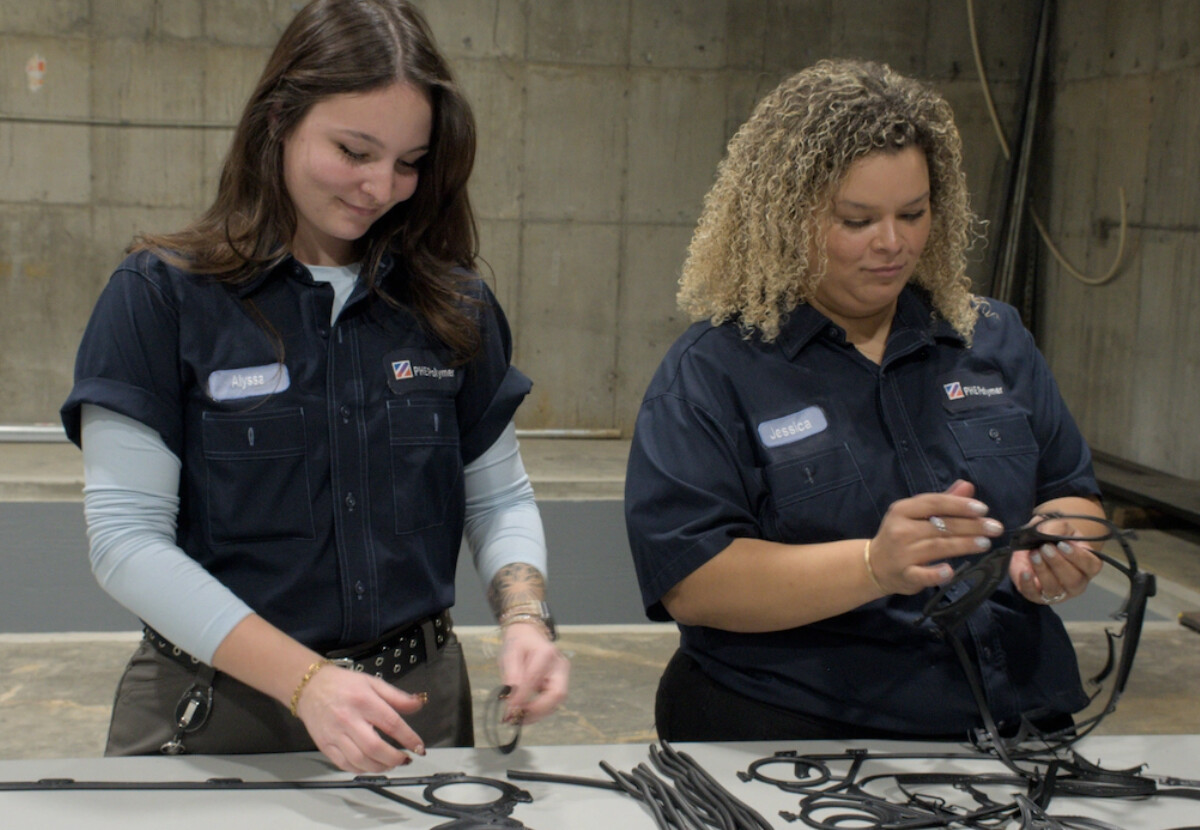 Two women working with heat exchanger gaskets